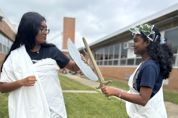 Rithika Gunasekaran 27 and Solai Ramasubramaniyam 27 reenacting a famous scene from the book, Song of Achilles by Madeline Miller, where protagonists Patroclus, the expelled prince, and Achilles, the fated best warrior train together.